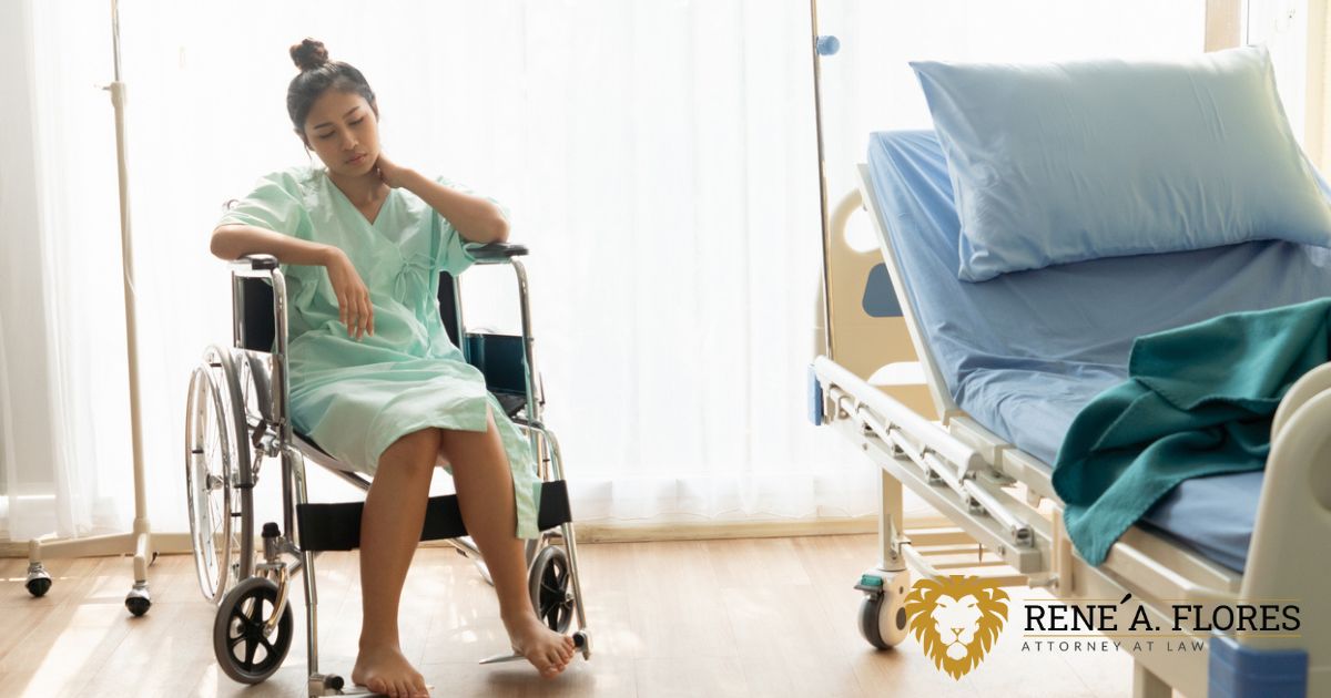 Injured woman in a wheelchair near her hospital bed